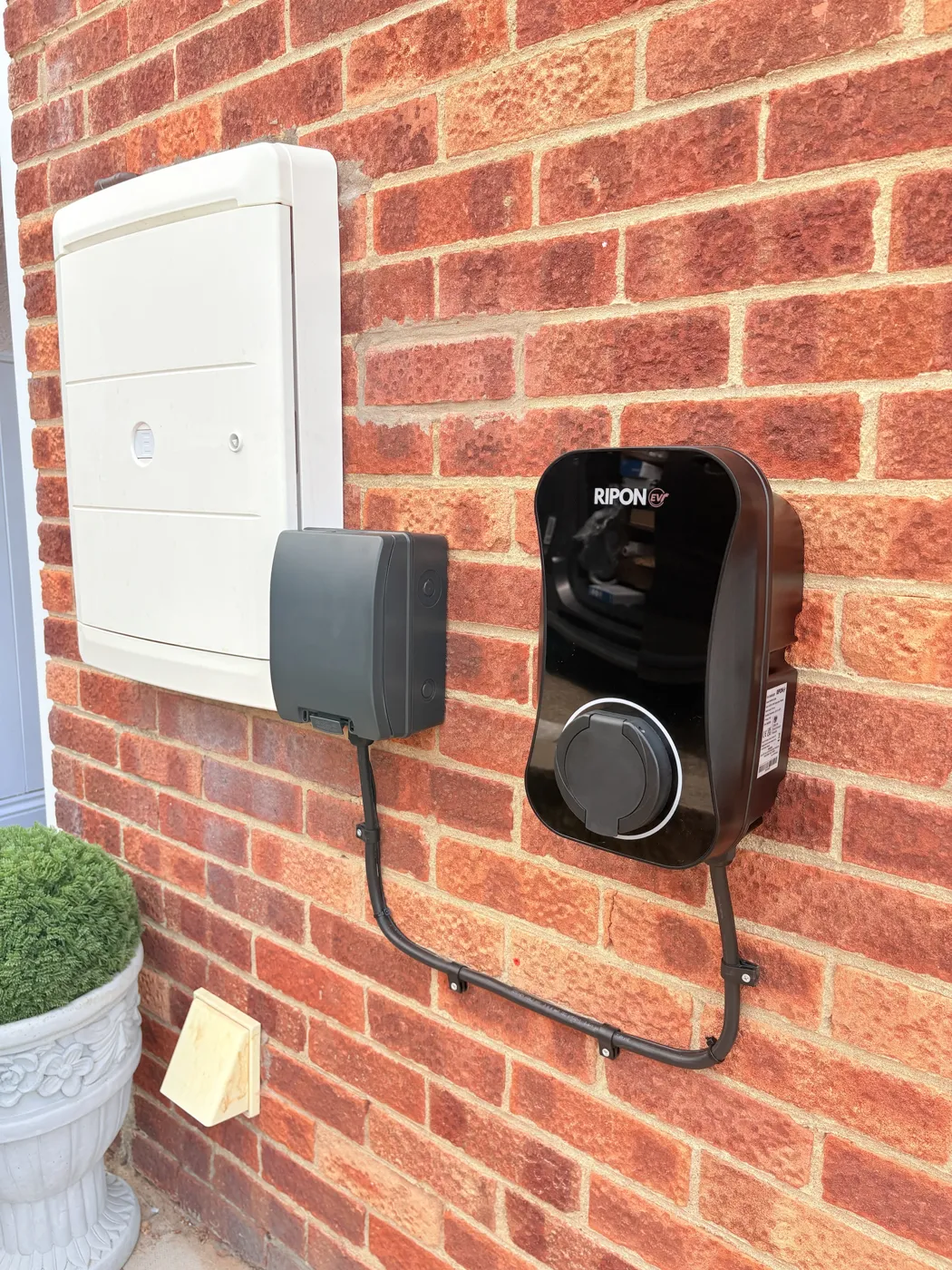 RiponEV charger, isolator and meter box on a Bradford house wall