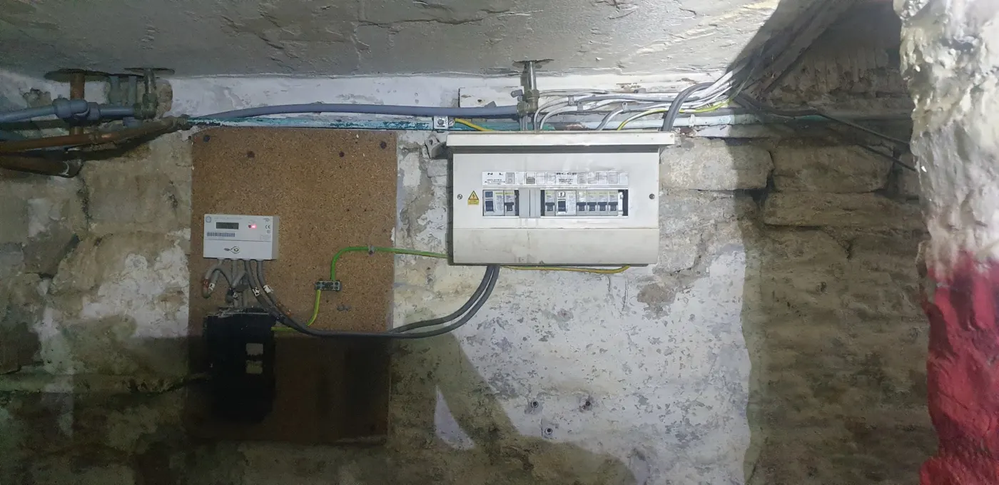 Ageing consumer unit in a stone cellar