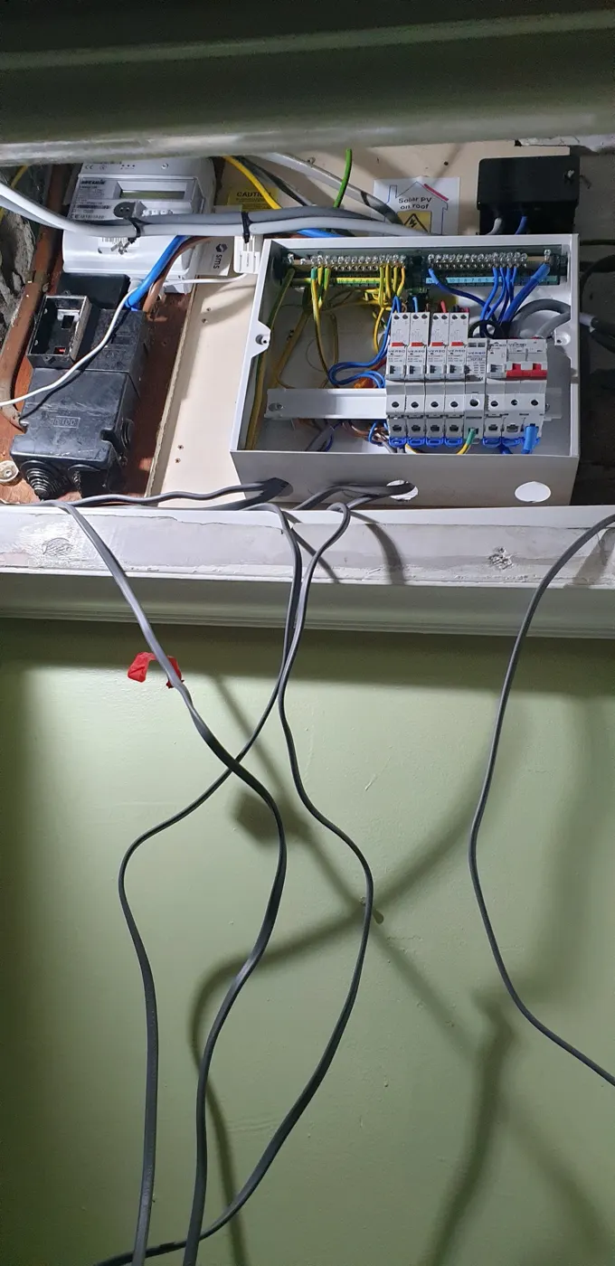 New Verso consumer unit wired neatly with RCBOs, beside the meter