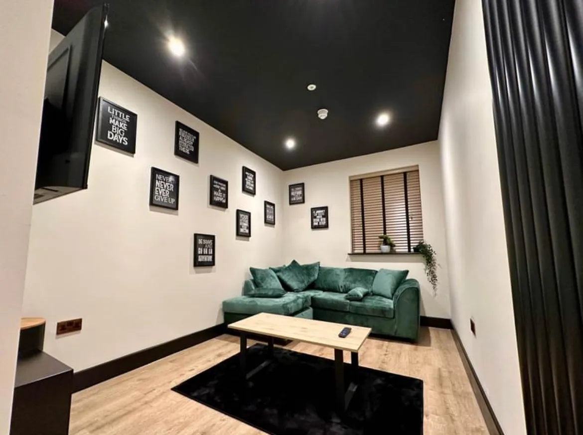 Finished lounge with LED downlights, smoke detector and wall-mounted TV point