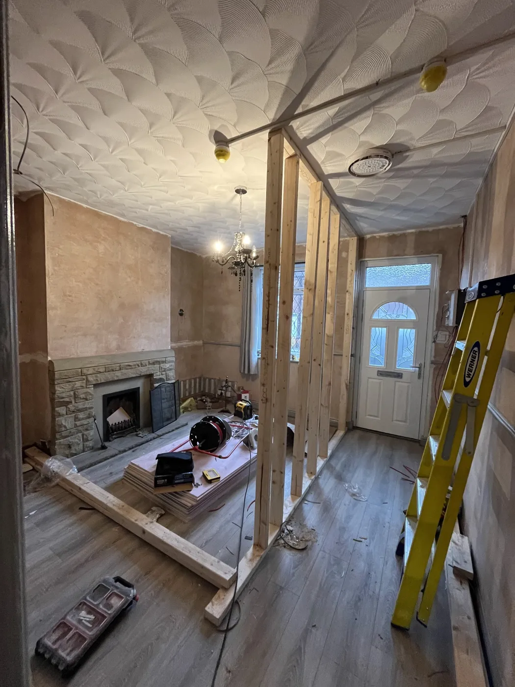 Room stripped back with a new timber stud partition and new fire alarm cabling on the ceiling