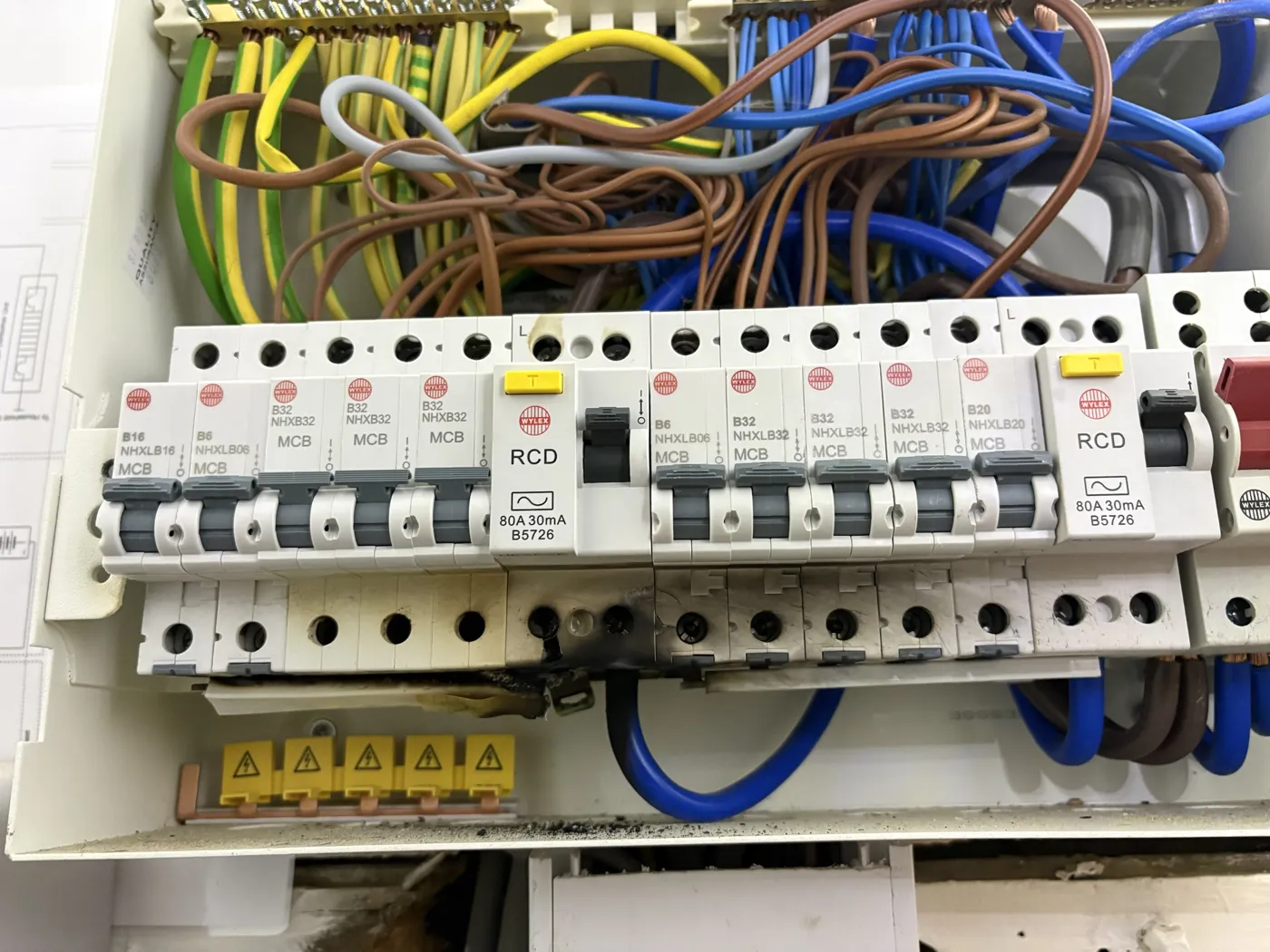 Consumer unit with a scorched busbar and RCD found on an emergency call-out