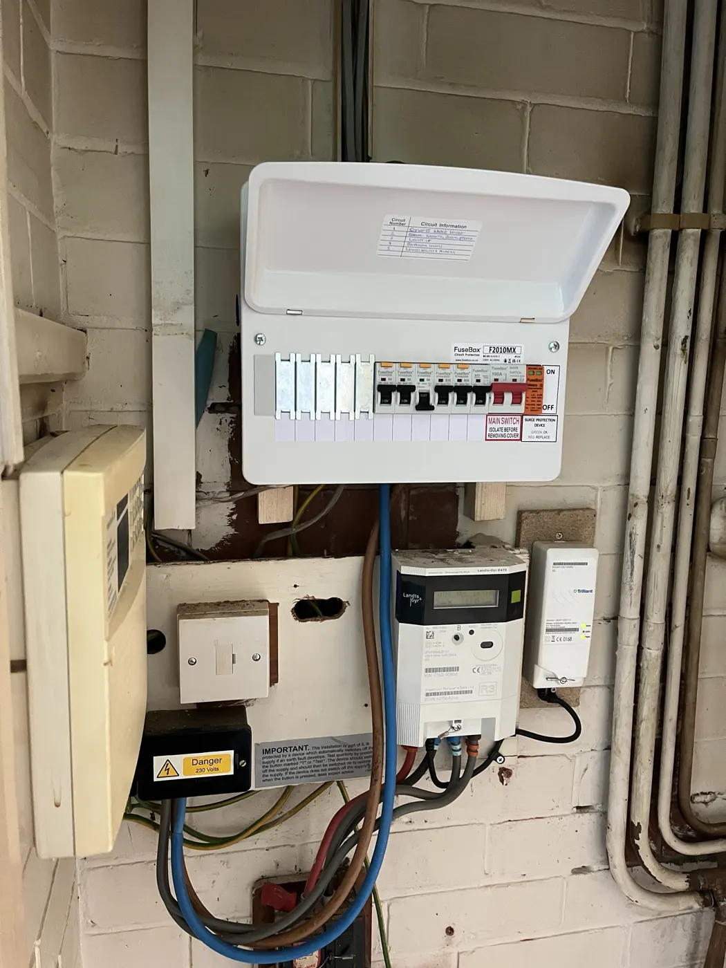 New consumer unit open showing RCBOs, surge protection and a circuit chart