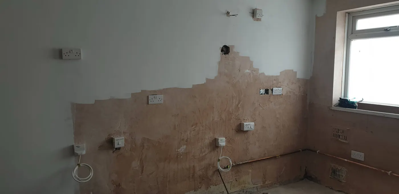 Kitchen after a rewire with new sockets and labelled appliance switches