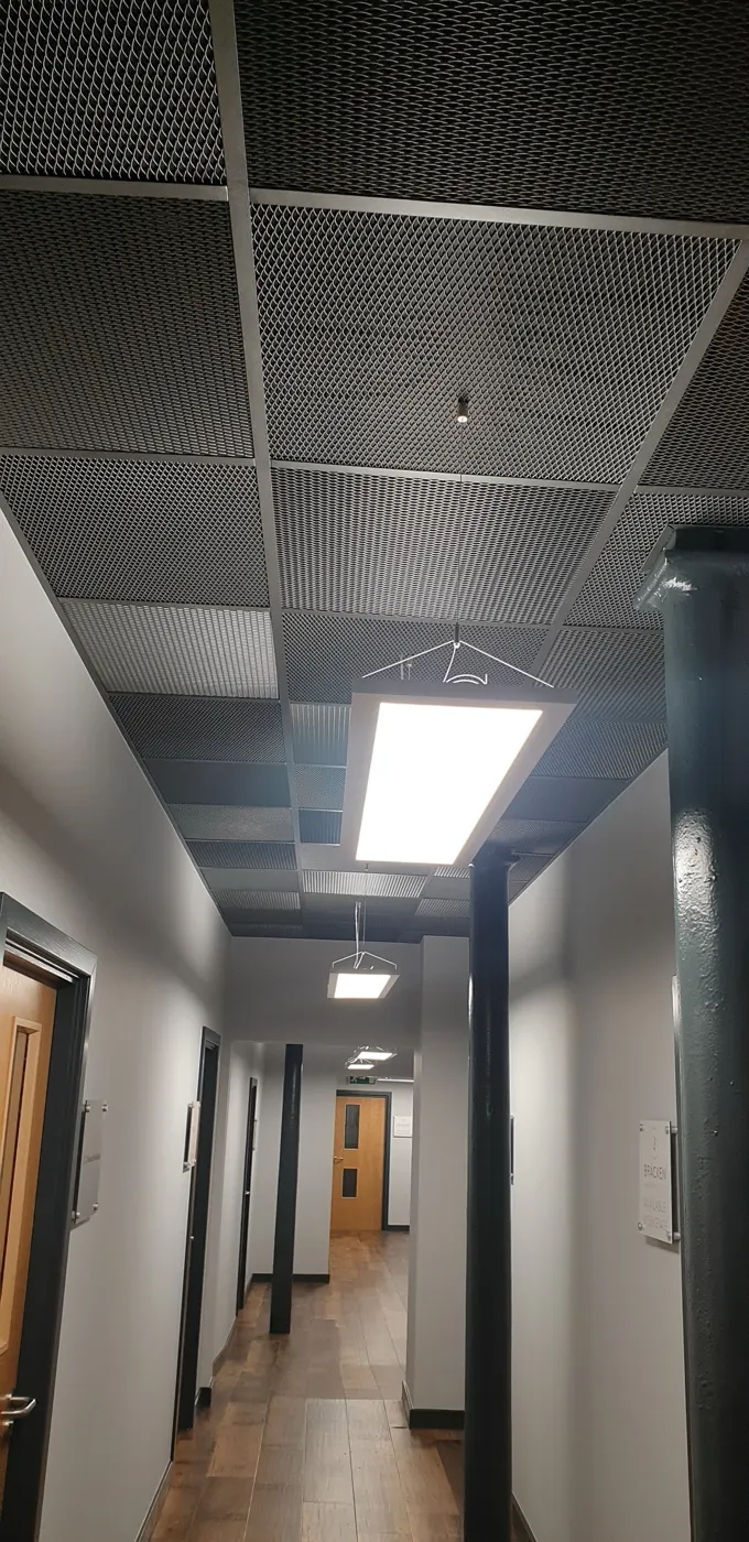 Office corridor with suspended LED panels