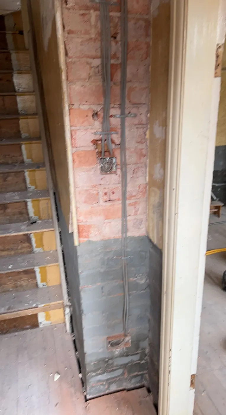 Hallway wall with new cable drops to switch and socket boxes