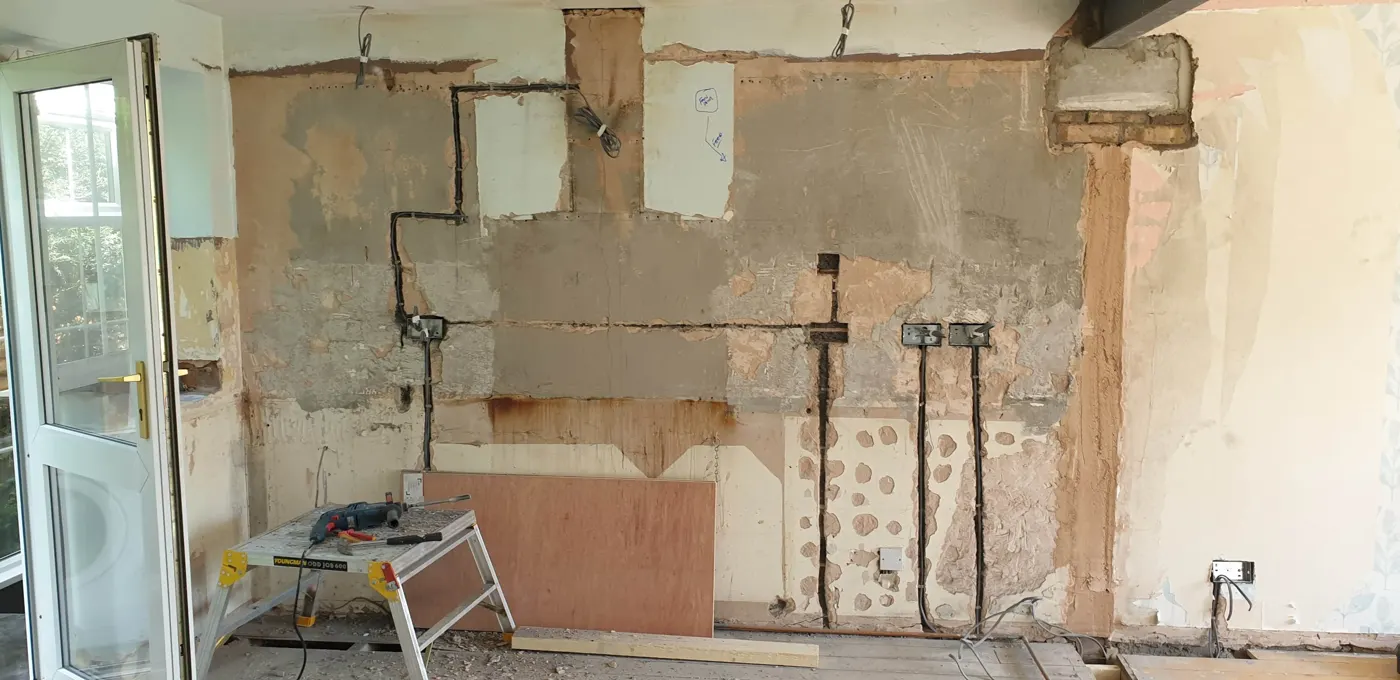 Kitchen wall chased with new cables and back boxes fitted