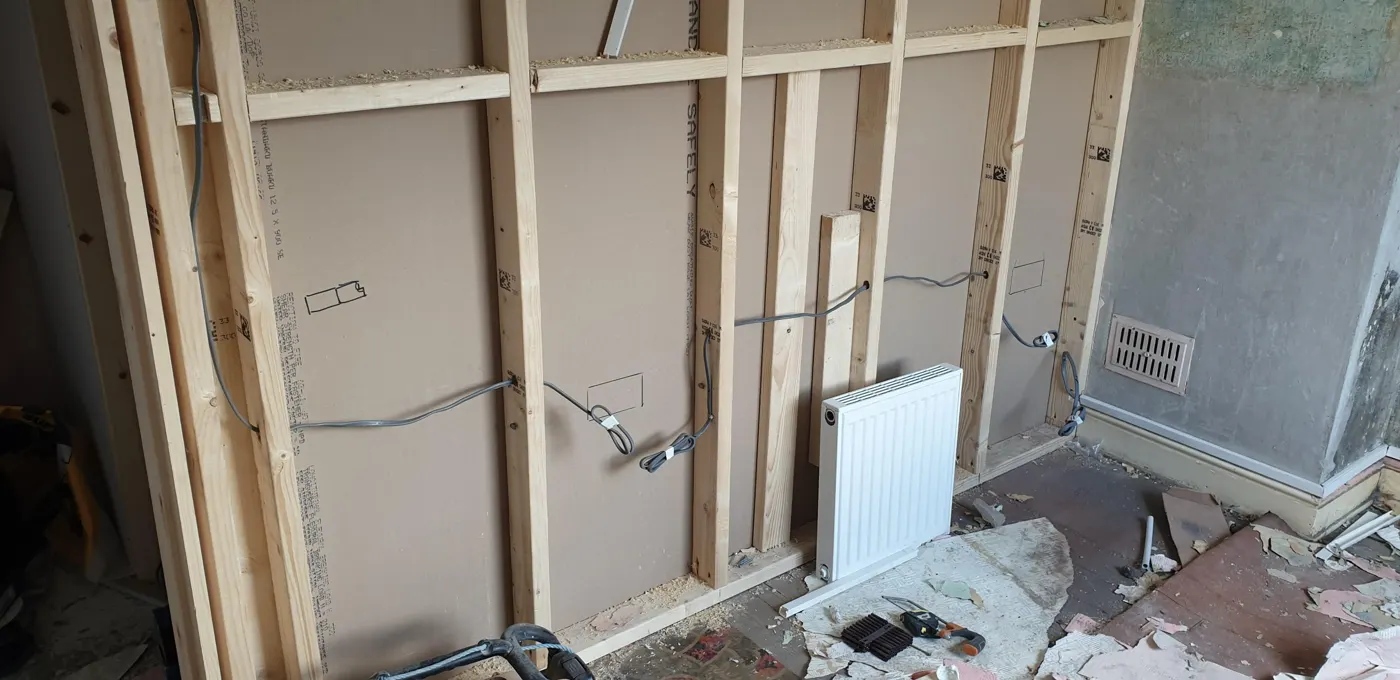 New stud wall with cables run before boarding