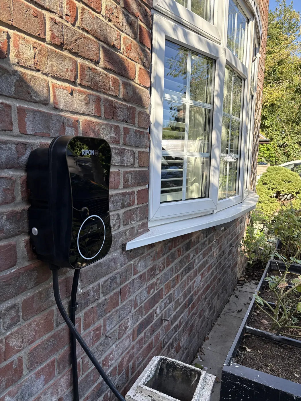 RiponEV charger fitted beside a bay window