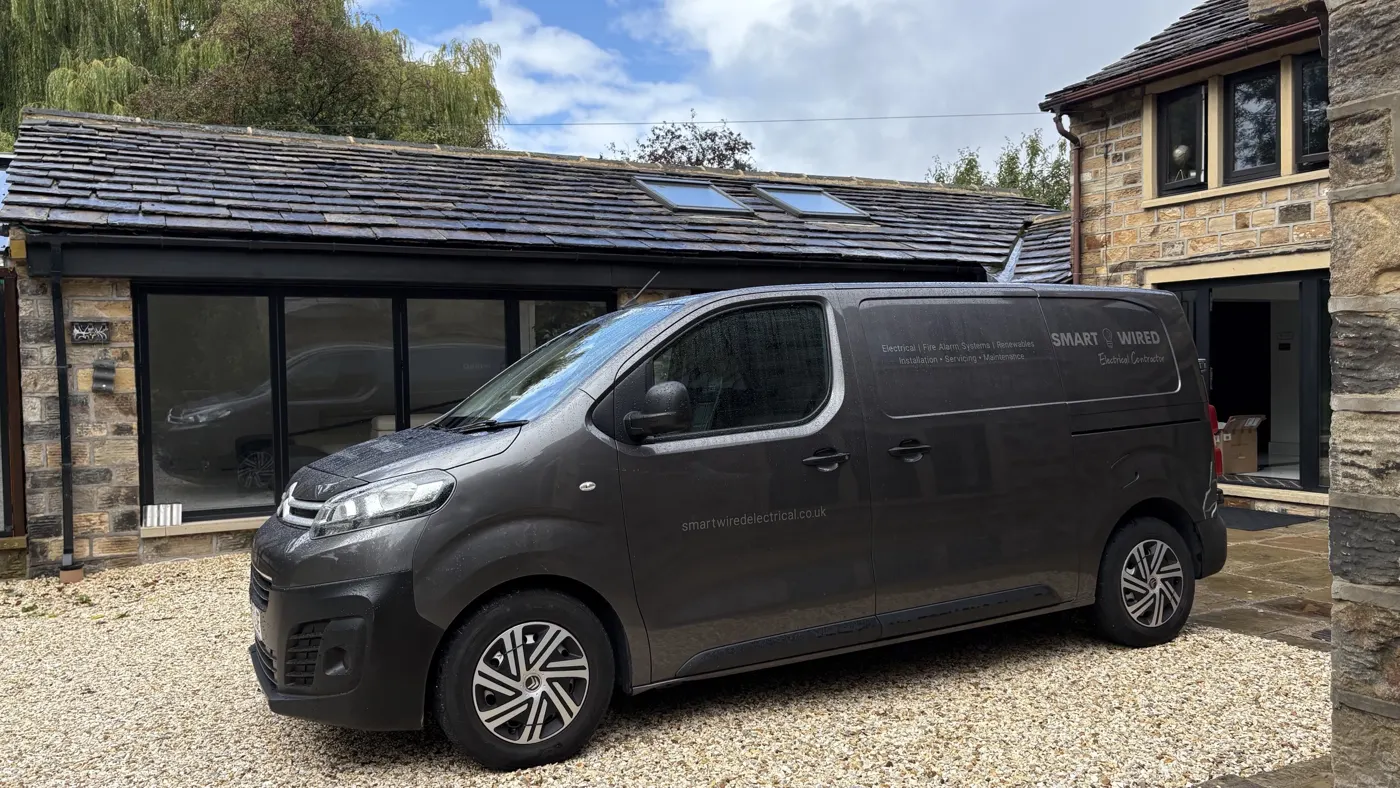 SmartWired Electrical van on the drive of a stone-built Yorkshire home
