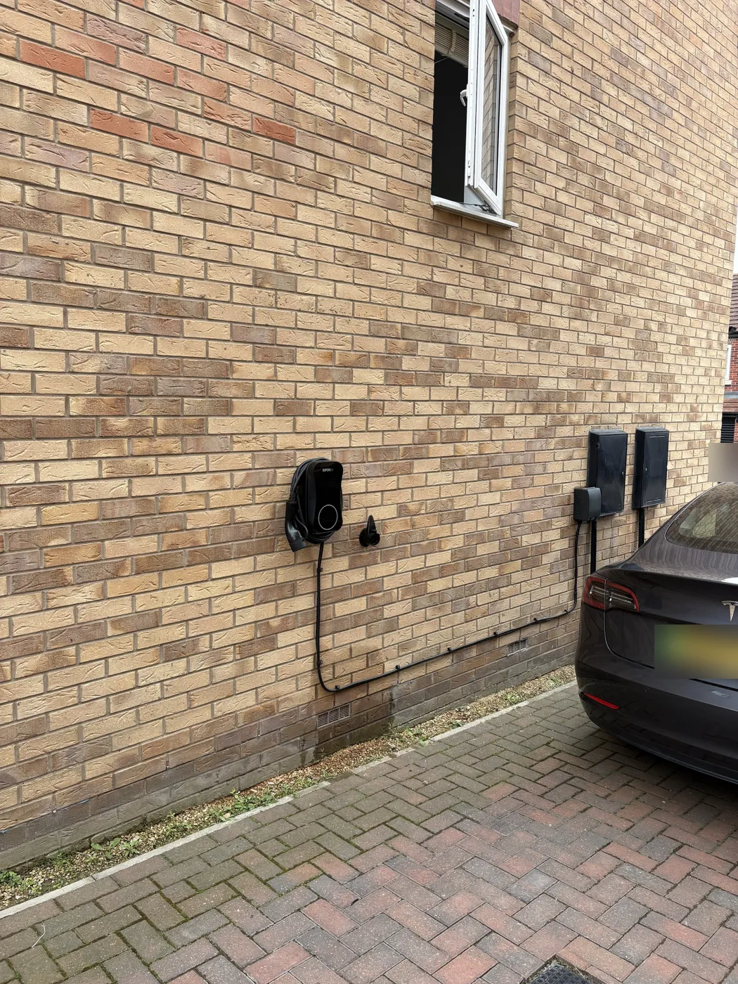 Cable run from the outside meter box and isolator along the wall to the RiponEV charger